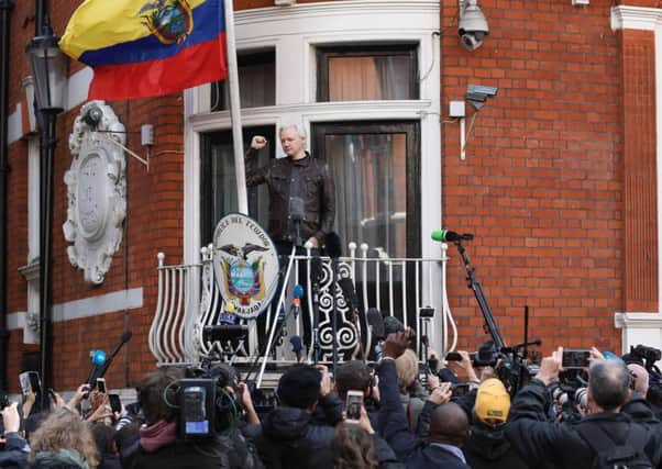Julian Assange speaks from the balcony of the Ecuadorian embassy in London back in 2017. (Philip Toscano/PA Wire)