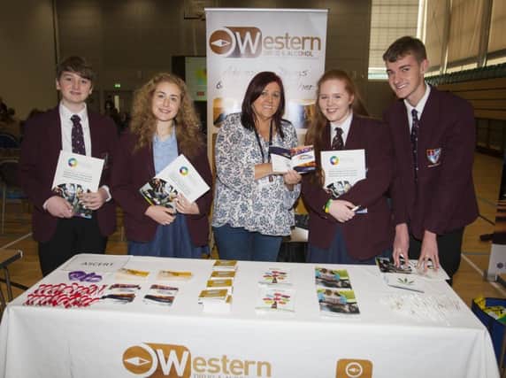 Foyle College students George Levins, Sasha Porter, Sarah Orr and Fred Glavin pictured during Fridayâ¬"s Derry City and Strabane District Councilâ¬"s Schools Mental Health Awareness event at the Foyle Arena with Bernie Hutton, counsellor, Ascert.