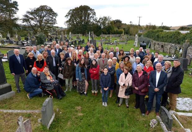 Members of the O'Doherty Clan pictured in Ardmore Cemetery, during a visit to the grave of their ancestor Charles ODoherty, who died in 1915. The visit to the cemetery was part of the O'Doherty Clan Reunion events held in the Beech Hill Hotel last weekend. DER4119GS  061