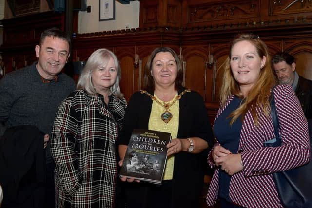 Brian McMahon, Anne Marie McCosker and Brihid Sheridan pictured with the Mayor of Derry City and Strabane Colr.  Michaela Boyle at the launch of Children of the Troubles in the Guildhall on Tuesday evening last. DER4219GS  006
