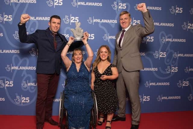 Ulster GAA coaches Shane McCann and Paul Callaghan and wheelchair hurling goalkeeper Geraldine McGarrigle with Paralympic swimmer Ellie Simmonds and their 25th Birthday National Lottery Award for Best Sports project.