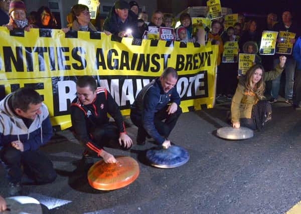 Border Communities Against Brexit supporters rattle bin lids at the protest held at Bridgend on Wednesday evening last.  DER4119GS - 030
