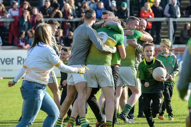 Foreglens players and supporters celebrate their Derry Intermediate Football Championship win over Claudy in Celtic Park on Sunday. DER4319GS  007