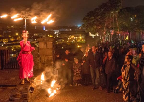 One of the fire dancers performs during the Awakening of The Walls in Derry during a previous Hallowe'en festival. Awakening of The Walls returns from Monday to Wednesday. Picture Martin McKeown. Inpresspics.com. 28.10.16