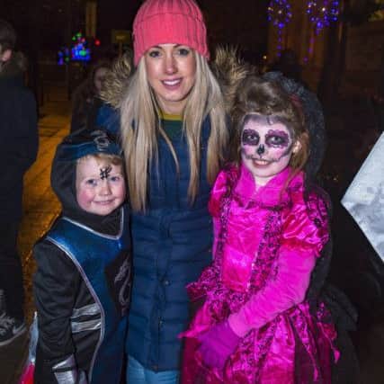 Cillian and Katie Donaghy with their mum Bronagh at the celebrations on Halloween night last year.  (Picture George Sweeney) DER4418GS010