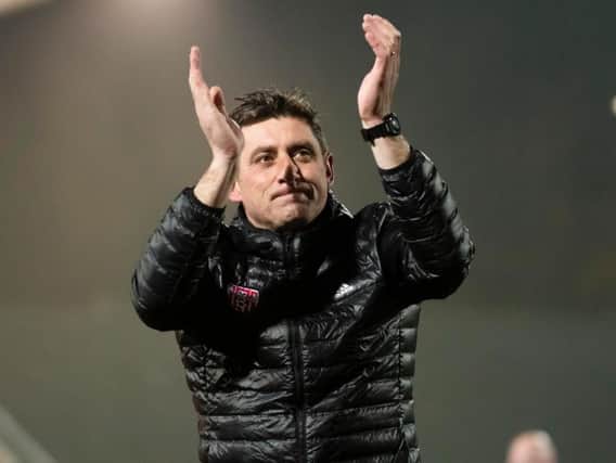 Declan Devine applauds the home support after clinching European football with victory over Finn Harps.