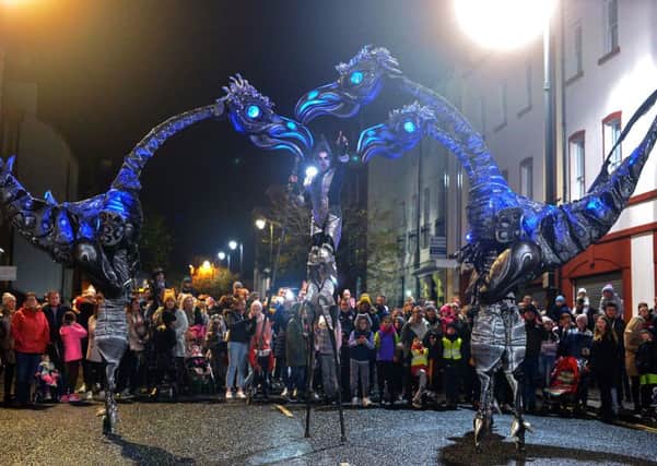 The giant Sarusus entertain the crowds at the Awakening on the Walls carnival in the city centre.  DER4419GS - 016