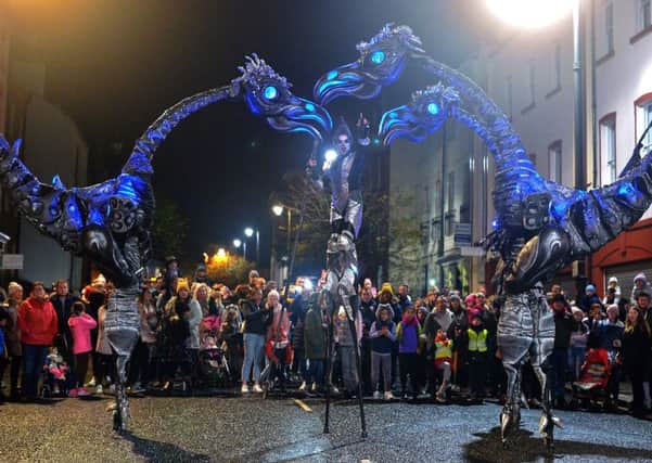 The giant Sarusus entertains the crowds at the Awakening on the Walls carnival in the city centre.  DER4419GS - 016