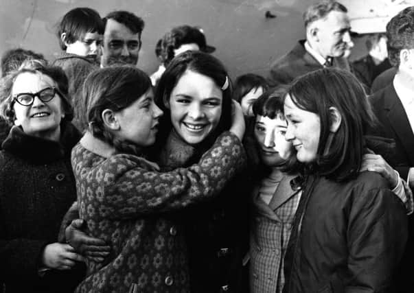 Dana is greeted by relatives and well wishers after arriving into Ballykelly on the special Aer Lingus flight from Amsterdam following her historic Eurovision win with All Kinds of Everything in March 1970.