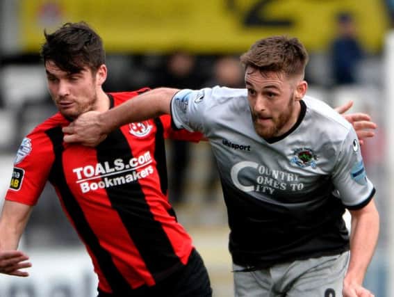 Institute's Niall Grace fired home their equaliser against Glentoran.