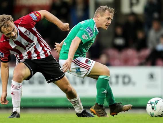 Former Cork City captain, Conor McCormack, pictured battling with ex-Derry City midfielder, Greg Sloggett last season, has opened talks about a return to Brandywell.