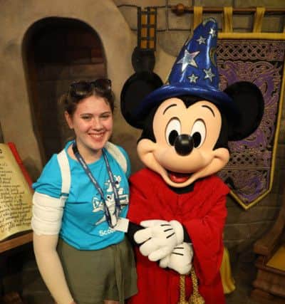 Roisin with Mickey Mouse at Disney World, Flrorida.