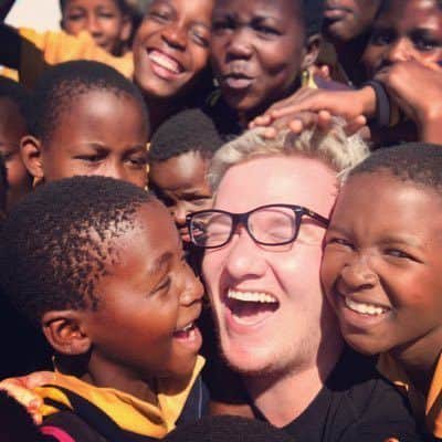 Craig 'Mini Ladd' Thompson with some of the children he met during his trip with the Thirst Project. He raised $150,000 dollars for the charity during live streams.