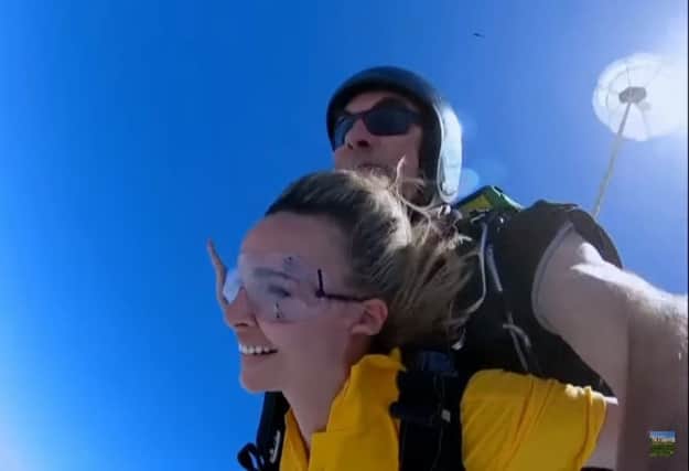 Nadine overcomes her fears to sky dive out of a plane on the opening day of her I'm A Celebrity adventure. (ITV Youtube)