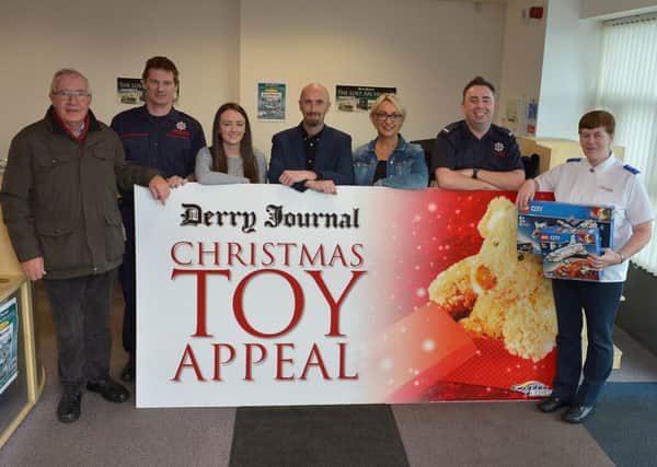 Launching the 20th annual Derry Journal Christmas Toy Appeal are from left to right: Bill Etherson, St. Vincent DePaul, Richard Ayton, NI Fire & Rescue Service Northland Road (Red Watch), Aideen McGrory, Brendan McDaid and Jacqui Diamond, Derry Journal, Patrick Kennedy, NI Fire & Rescue Service Northland Road (Red Watch) and Doreen Chapman from the Salvation Army. (Picture by George Sweeney)