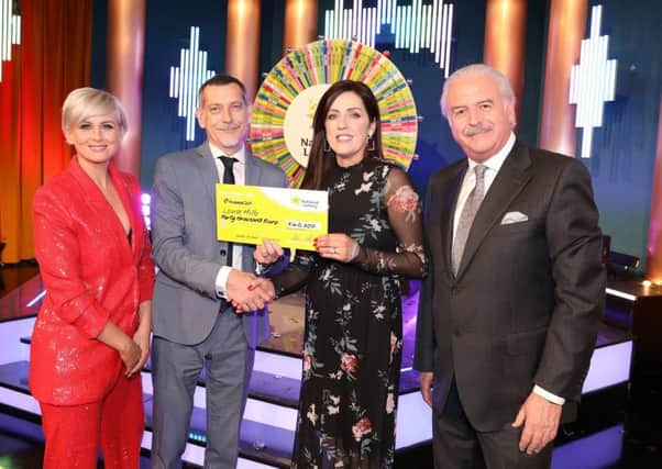 Louise Mills, from Culdaff, Co. Donegal has won 40,000 euro on last Saturday'sNational Lottery Winning Streak Game Show.  Pictured here at the presentation of the winners cheques were from left to right: Sinead Kennedy Winning Streak co-host; Ronan Leech, The National Lottery; Louise Mills, the winning player and Marty Whelan, Winning Streak Game Show co-host. The winning ticket was bought from An Post, Carndonagh, Co. Donegal. Pic. Justin Mac Innes/ Mac Innes Photography