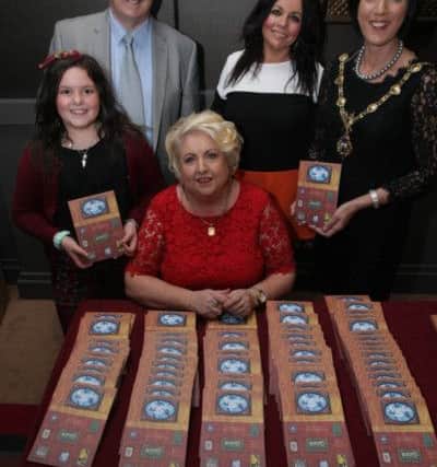 REMEMBER ME. . . . .The Mayor of Derry, Councillor Brenda Stevenson pictured at the City Hotel on Wednesday evening for the book launch by Sadie O'Reilly of Hurt 'Remember Me - In memory of the young people who left this earth too soon.' Included in photo are Sadie's husband Dessie, daughter Vivienne and granddaughter Kaya (9). DER4214MC031