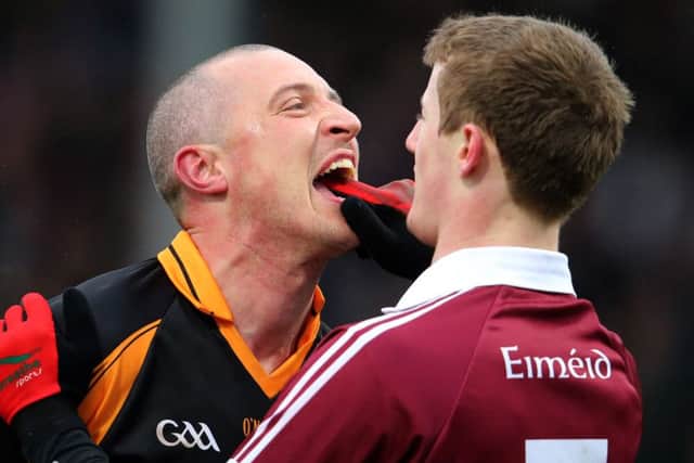AIB GAA Football All Ireland Senior Club Championship Semi-Final, O'Moore Park, Portlaoise, Co. Laois 15/2/2015 Austin Stacks vs Slaughtneil Kieran Donaghy celebrates in front of Brendan Rodgers of Slaughtneil after Austin Stacks scored a point Mandatory Credit ©INPHO/Cathal Noonan