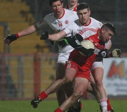 Derry's Mark Craig and Tyrone's Connor McAliskey and Sean Cavanagh.

 Photo Lorcan Doherty / Presseye.com