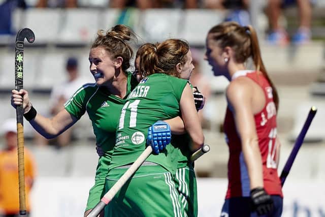 Megan Frazer and the Ireland players congratulate goalscorer Anna O'Flanagan on scoring their second goal.