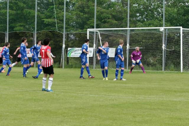 TOP CORNER!. . . .Greencastle netminder JP O'Doherty can only watch as Barry McNamee's sublime free kick heads for the top corner, during Sunday's game. DER2415MC144