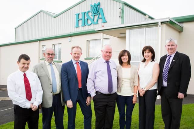 Hugh and Anne McWillliams (centre) and senior H&A company representatives join with Derry county chairman, Brian Smith, and secretary Danny Scullion.