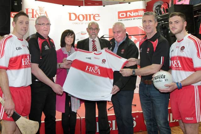 The new Derry GAA Jersey launch at O'Neills in Magherafelt on Wednesday night. Included are senior hurler Sean McCullagh, Tom McLean, senior hurling manager, Anne McWilliams,sponsor, Brian Smith,county chairman, Hugh McWilliams,sponsor, Damian Barton,senior football manager and senior footballer Daniel McKinless. (Picture Margaret McLaughlin)