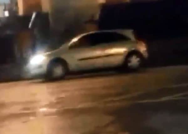 An image taken from the video that appears to show a car being driven recklessly up and down the Strand Road.