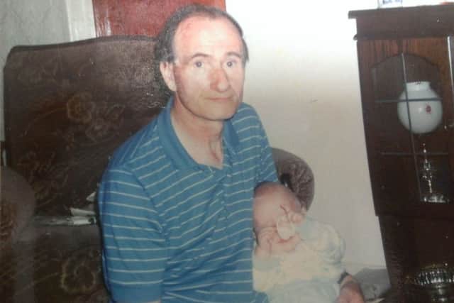 John Concannon with his son Edward when he was a baby.