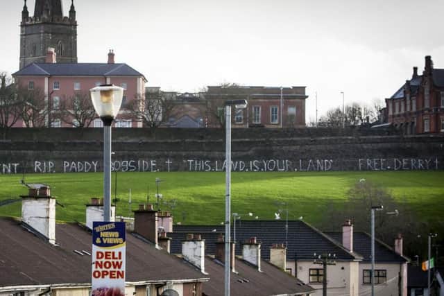 Grafitti adorning the Derry Walls overlooking Paddy "Bogside's" house in Westland Street before his funeral on Sunday morning. DER0116MC008