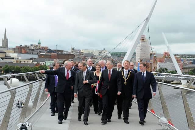 First Minister Peter D Robinson and Deputy First Minister, Martin McGuinness with other dignateries at the opening of the Peace Bridge back in 2011, one of the projects which Ilex helped deliver for Derry.