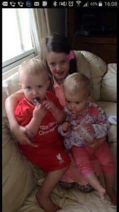 Lisa's three children Caidenn (2), Lea (8) and baby Cealach (1).