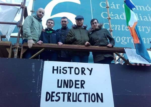 "gra members from Derry, CaolÃ¡n McGinley (third from left) ,Niall Rodgers (second from right) and Darren McGilloway (far right) pictured with James Connolly Heron (left) and Paddy Cooney at the #SaveMooreStreet protest at the weekend.