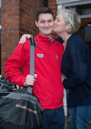 Conor Shortland  who is the Derry and Strabane Council area Clipper Race bursary representative to join the event. Conor will join the crew in Australia. Giving him a farewell kiss as he leaves on his adventure is mum Denise Walsh. Picture Martin McKeown. Inpresspics.com. 11.01.16