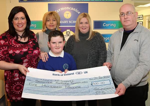 Termoncanice Primary School principal  Tina Doherty and vice PrincipalMary Harron present a cheque for Â£500 to Fiona and Sean McCloskey, and their son Michael McCloskey for the Niamh McCloskey Brighter Future Fund.  INLV0416-075KDR