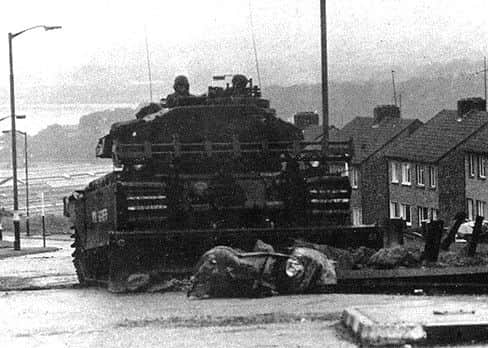 A Centurion tank fitted with a bulldozer blade makes its way up Eastway in Creggan, during Operation Motorman in July, 1972.