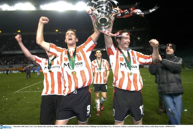 Derry City's Gary Beckett, left, and Barry Molloy, celebrate with the FAI cup at Lansdowne Road on December 2006.