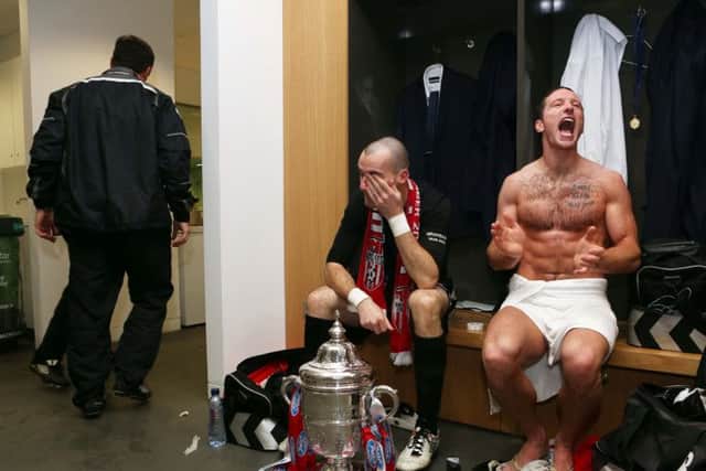 The Agony and the Ecstasy - Derry's Gerard Doherty and Barry Molly in the dressing room following Derry's victory in the FAI Cup final in 2012.