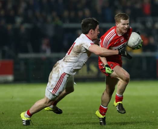Enda Lynn comes under pressure from Tyrone's Mattie Donnelly on Saturday night. (
Picture by Andrew Paton/Presseye.com).