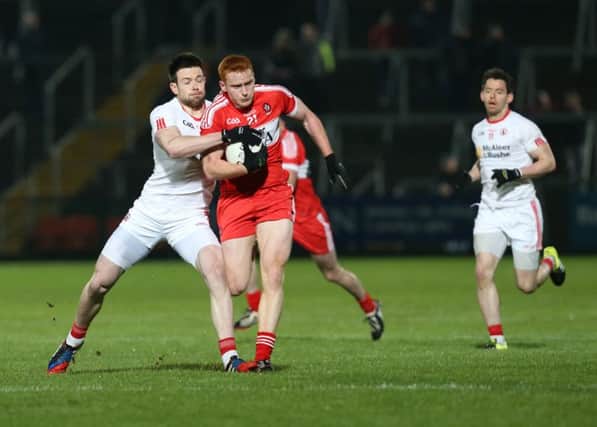 Conor McAtamney , in action against Conor Clarke of Tyrone in last week's McKenna Cup final, is likley to partner Emmet Bradley at midfield against Fermanagh on Sunday. (
Picture by Andrew Paton/Press Eye.com)