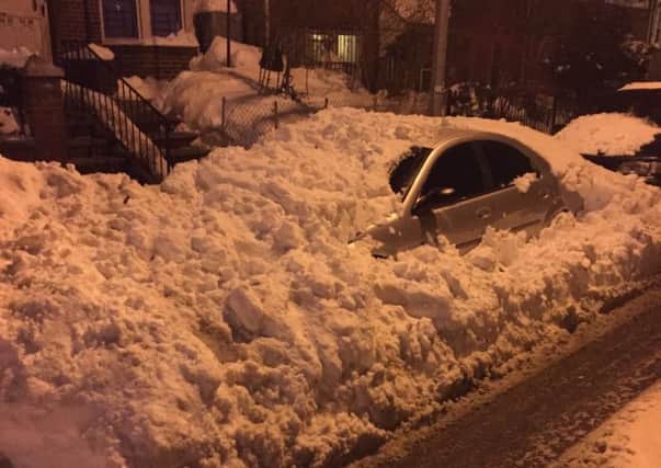Cars covered in snow outside of Derry man Joseph Mahon's apartment in Queens.