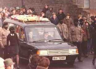 An INLA guard of honour flanks the funeral cortege of Neil McMonagle in February 1983.