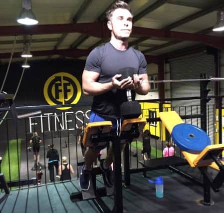 Simon Collins pictured during a tough chest and back session at FF Fitness' muscle camp.