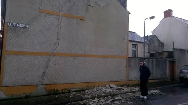 Masonry came crashing to the ground during Storm Henry in Derry on Tuesday evening. Pictured at the scene is Sinn Fein Councillor, Mickey Cooper.