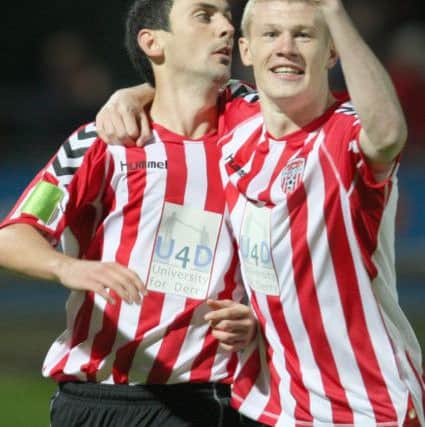 Former Derry City team mate, James McClean, celebrates with Mark during a game against Mervue United.