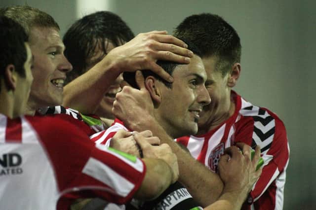 Mark Farren is swamped by team mates after scoring one of his many goals for Derry City. Photo: Lorcan Doherty Photography