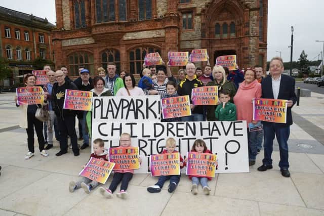 Residents of Strathfoyle pictured at a previous protest outside the Guildhall.