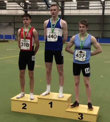 Stephen McGahey on the podium after his 200m silver performance at the NI & Ulster Indoor Age Group Championships.