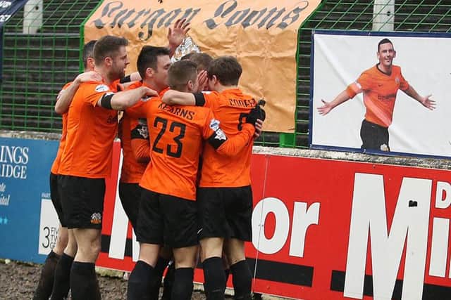@Press Eye Ltd Northern Ireland- 6th February 2016
Mandatory Credit -Brian Little/Presseye
Glenavon Rhys Marshall celebrates in front of the Mark Farren tribute banner after scoring the opening goal against Glentoran during Saturday's Tennents Irish Cup sixth round tie at the Oval.
Picture by Brian Little/Presseye