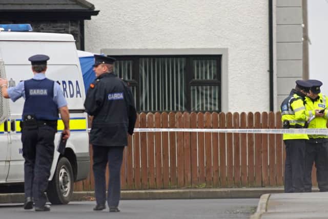 Gardai officers pictured at the scene of the fatal shooting of Andrew Allen at Links View Park, Lisfannon. 1402JM06